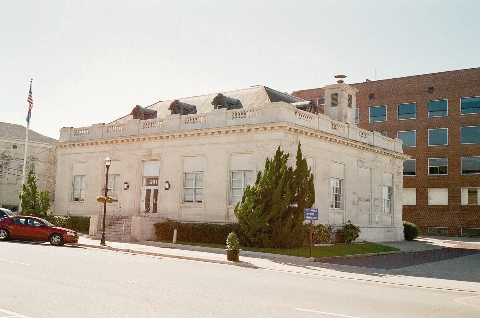 The white stone Federal Building in Ruston with a flag out front